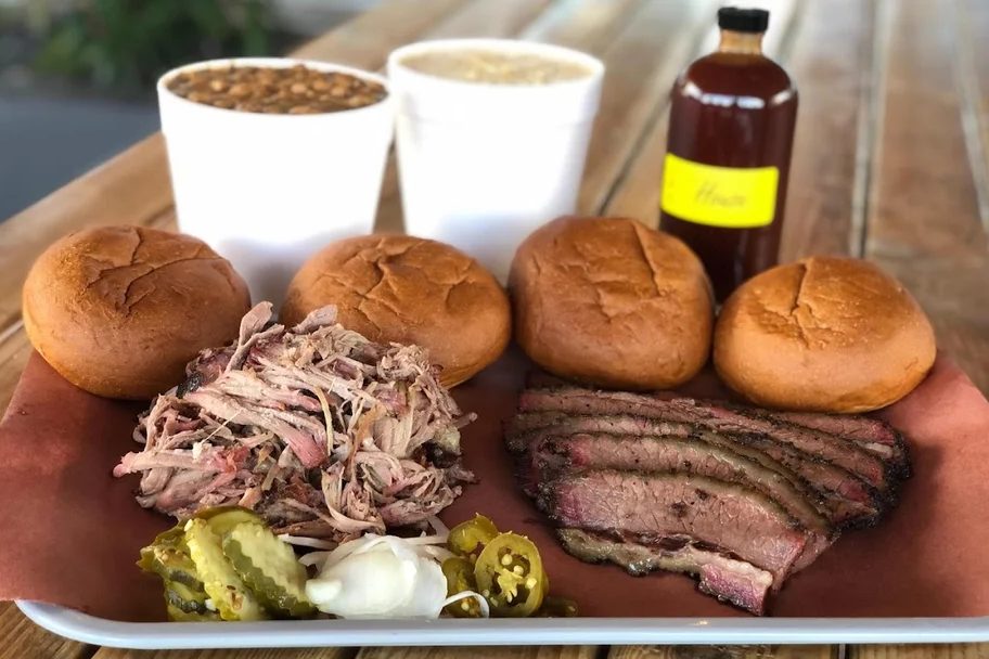 Tray of sliced brisket, pulled pork, buns, pickles and jalapeños at Little Miss BBQ in Phoenix
