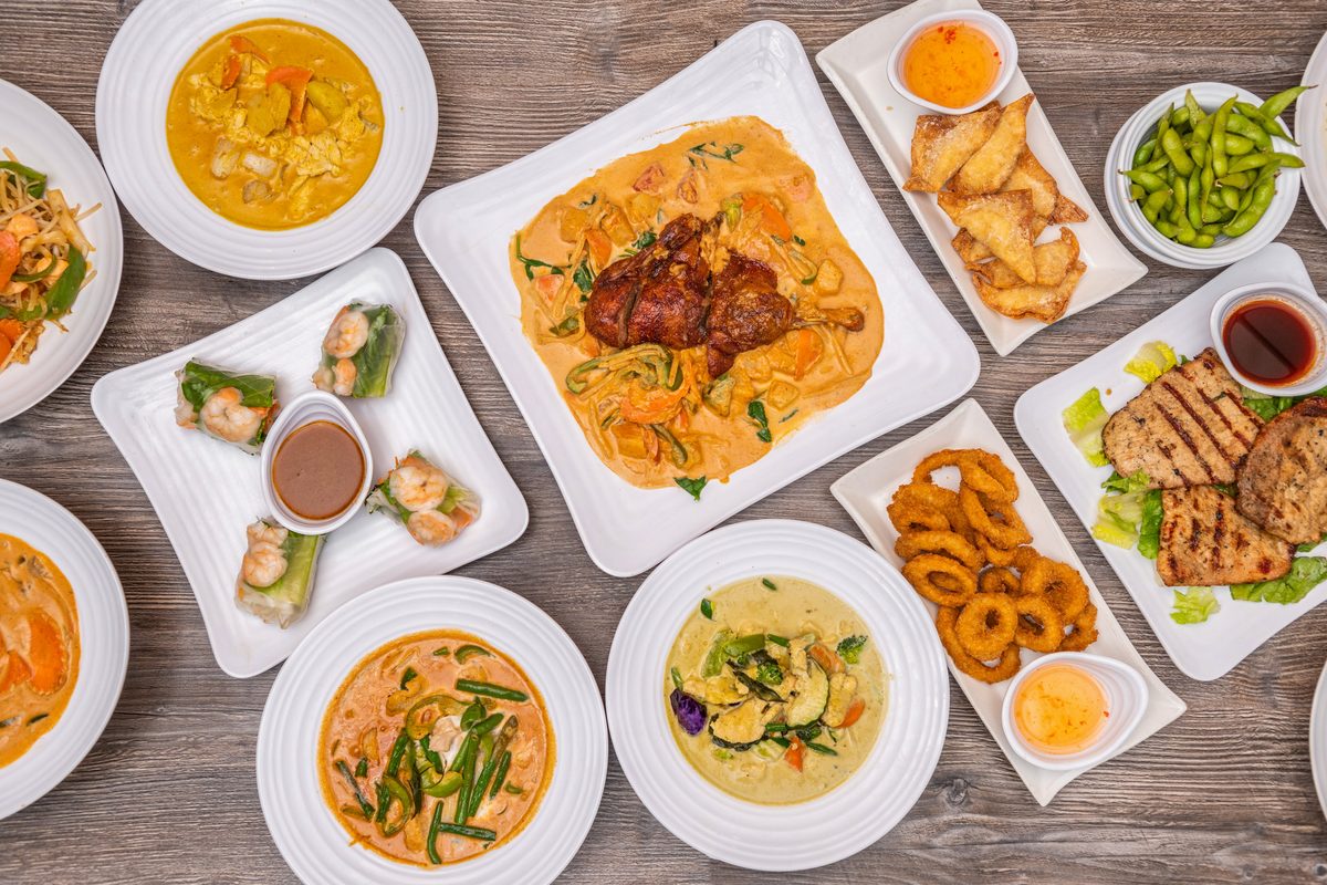 Spread of curries, spring rolls, grilled meats and noodle dishes at Thai Recipe Bistro in Phoenix