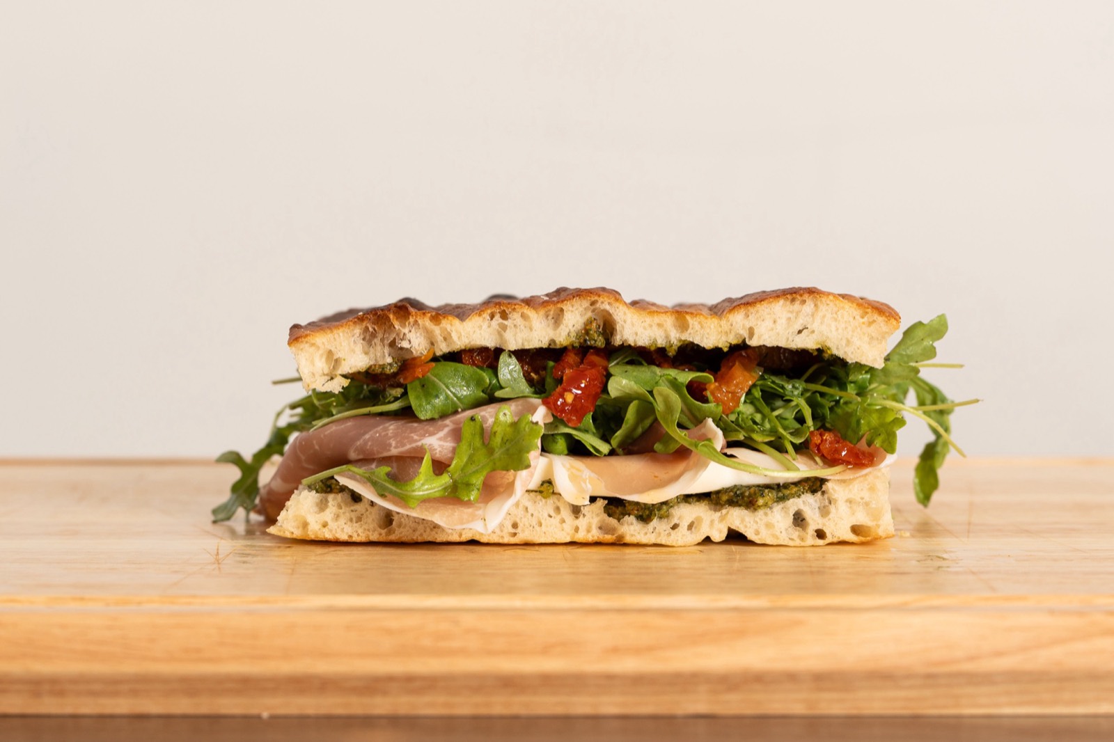 Starting QB sandwich — prosciutto, fresh mozzarella and pesto on schiacciata