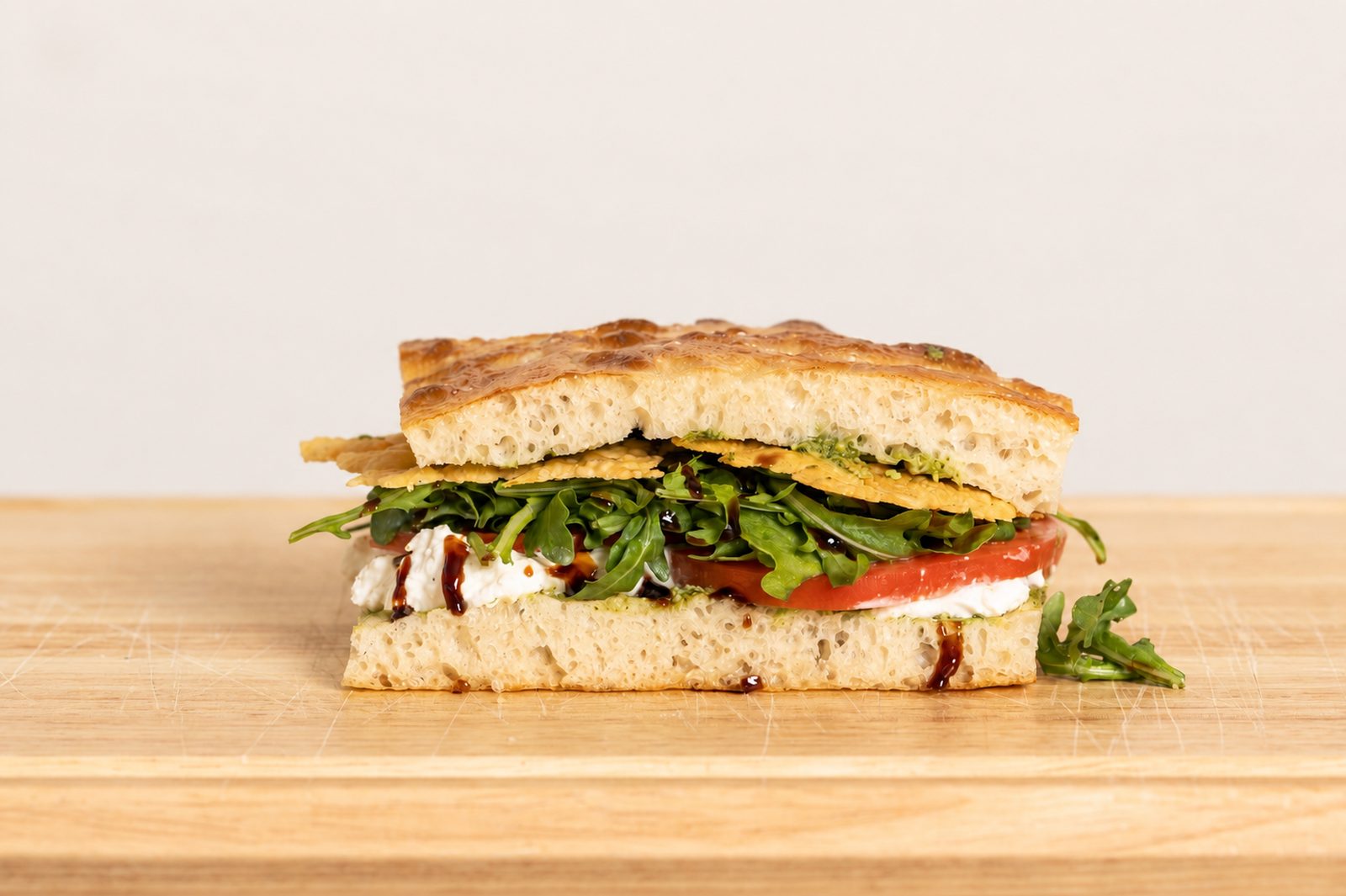 Field Day sandwich — stracciatella, tomato, arugula and balsamic glaze on schiacciata