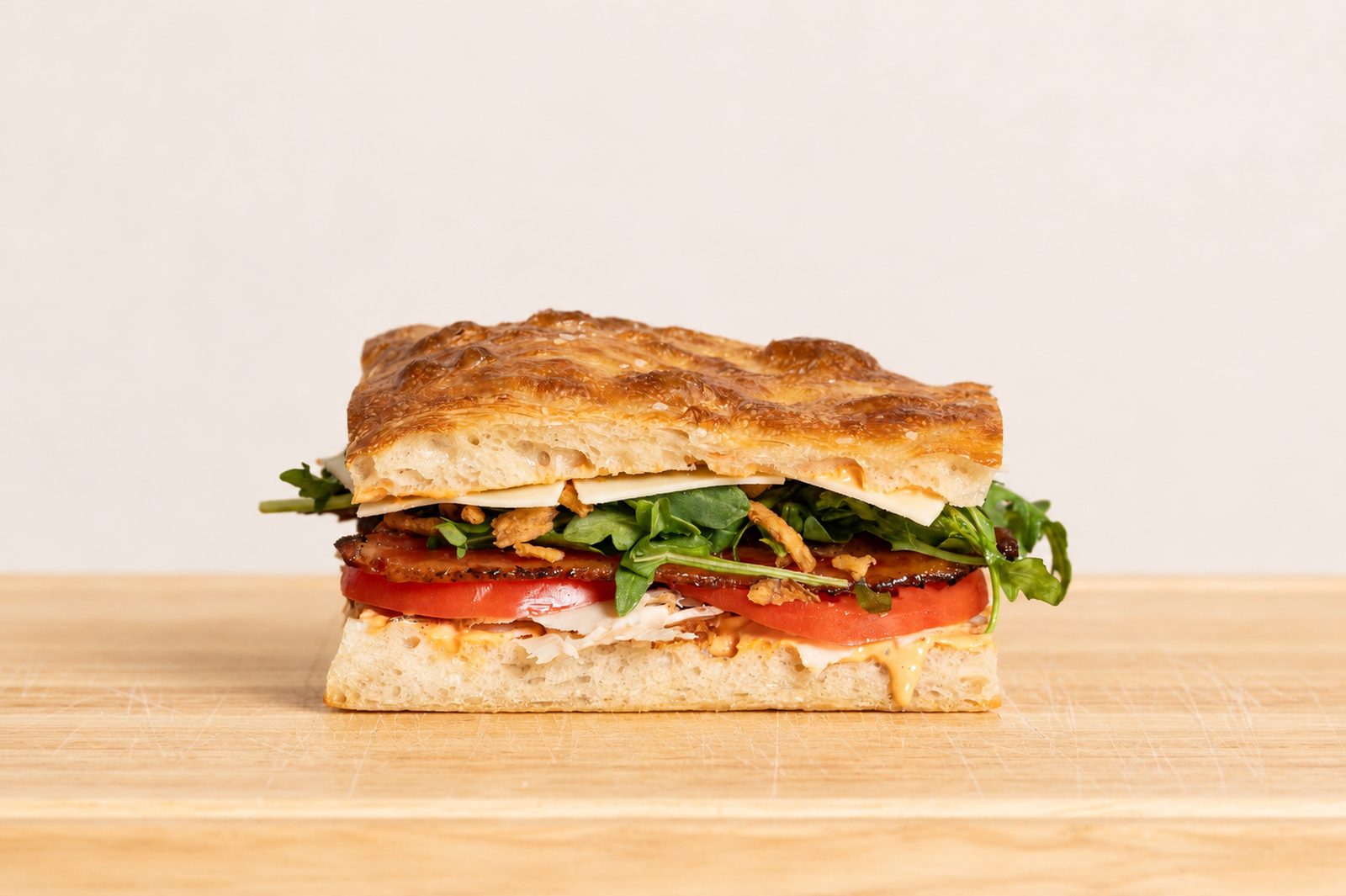 Fire Drill sandwich — chicken, jalapeño peppered bacon, cheddar and crispy onions on schiacciata
